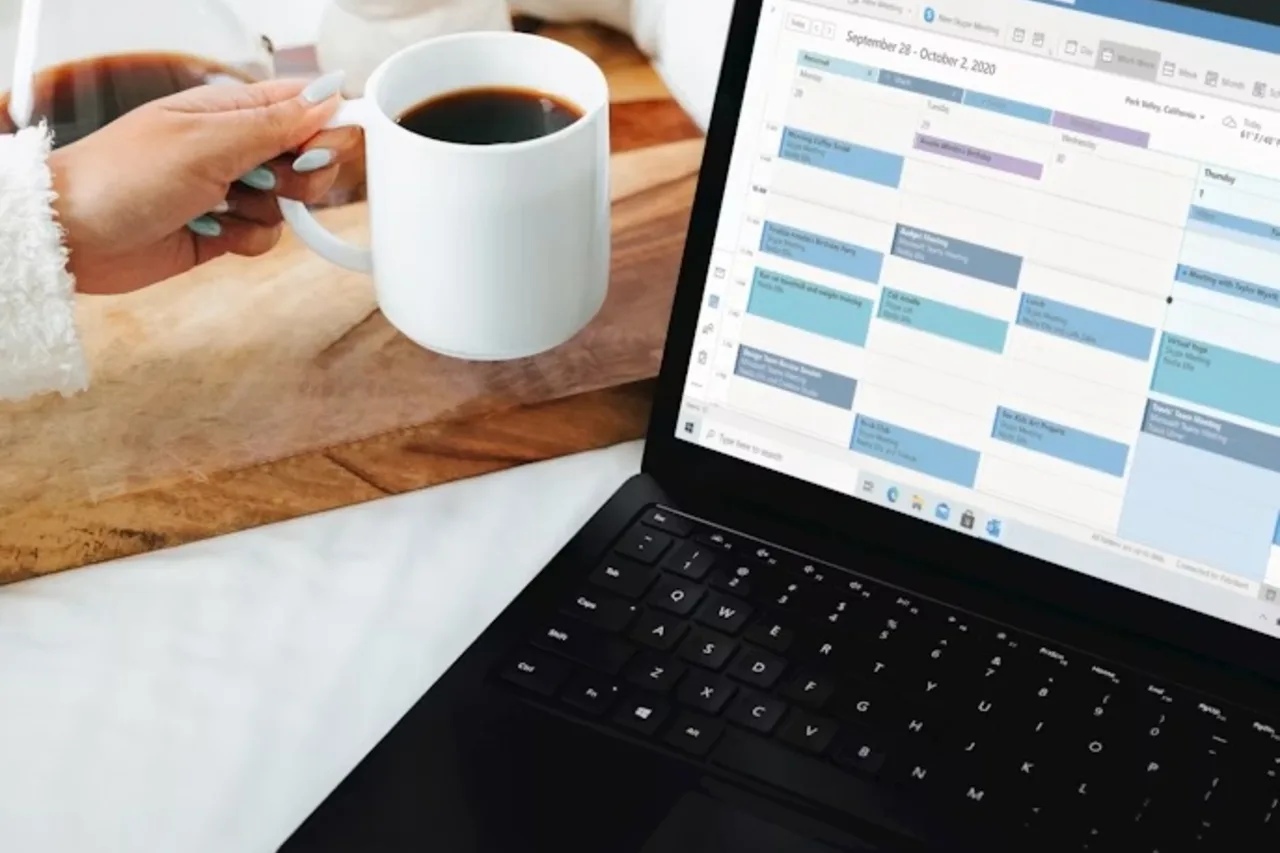 Planning a corporate event budget on a laptop
