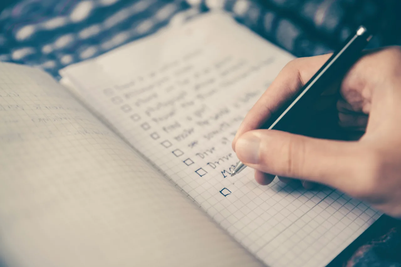 Reviewing an event venue contract and checklist before booking